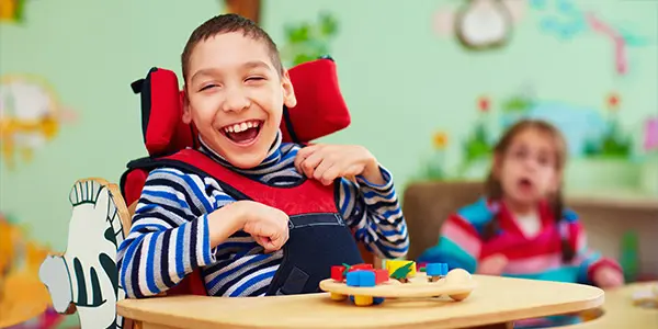 smiling boy with Spina Bifida